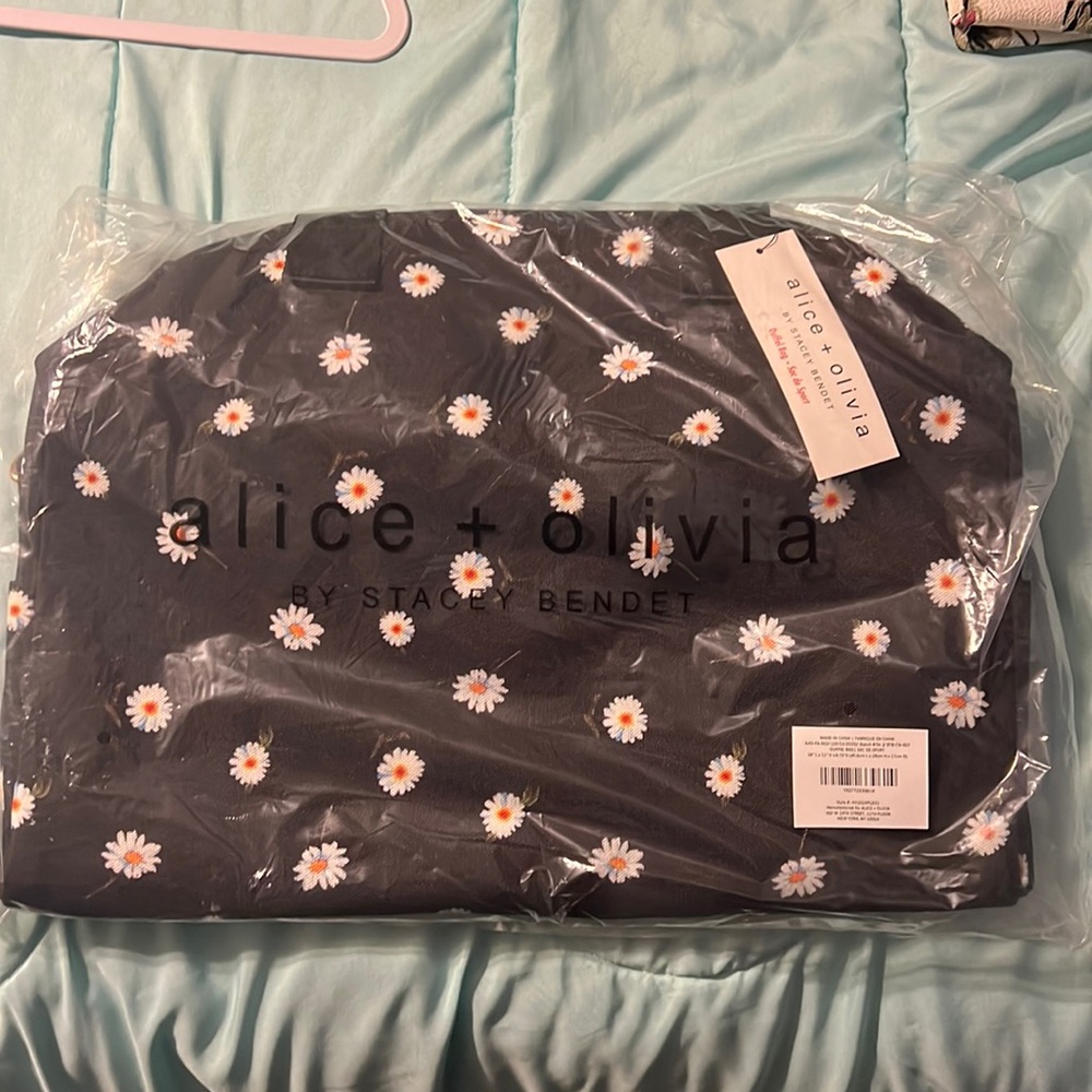 alice + olivia • Daisy Print Duffel Bag FabFitFun black canvas floral satchel